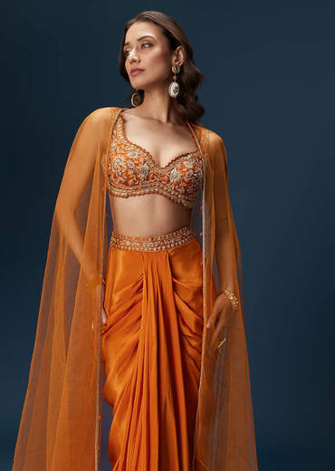 rust-dhoti-skirt-set-with-embellished-blouse-and-tassel-net-dupatta-sg320249-1_1452b20f-4b00-48cb-9167-18a97d693da5.jpg