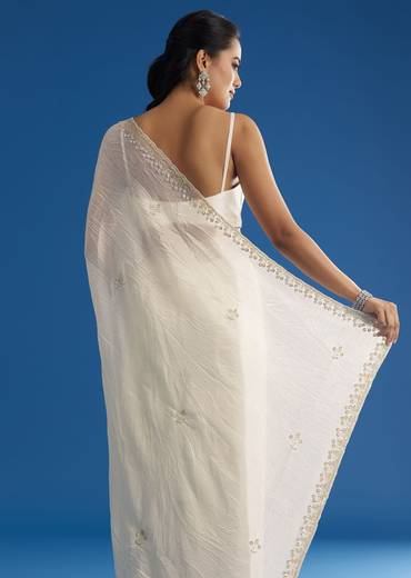 white-crushed-tissue-saree-with-stones-and-sequins-embroidery-and-scallop-border-sg296145-1_6995dc06-c2df-4093-b0d0-3eed0006324a.jpg