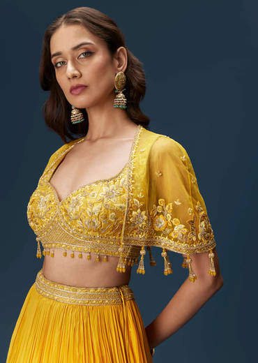 yellow-bridesmaid-lehenga-with-sleeveless-blouse-and-draped-cape-sg334681-1_2bcfb1f5-70c9-4939-91b2-9785346e3d9c.jpg