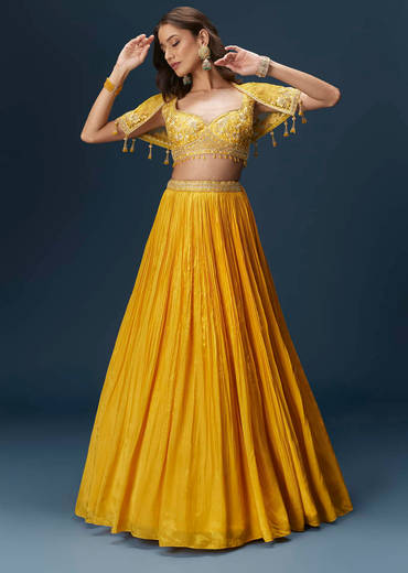 yellow-bridesmaid-lehenga-with-sleeveless-blouse-and-draped-cape-sg334681-1_2bcfb1f5-70c9-4939-91b2-9785346e3d9c.jpg