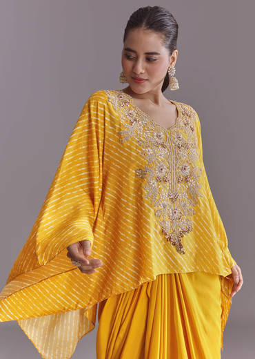 yellow-silk-kaftan-top-and-drape-skirt-set-with-leheriya-print-sg319255-1.jpg