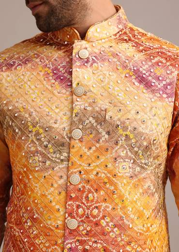 Sunny Festive Couple Set – Yellow Organza Floral Saree With Beaded Border For Her And Orange Tie-Dye Jacket Kurta Set With Mirror Work For Him