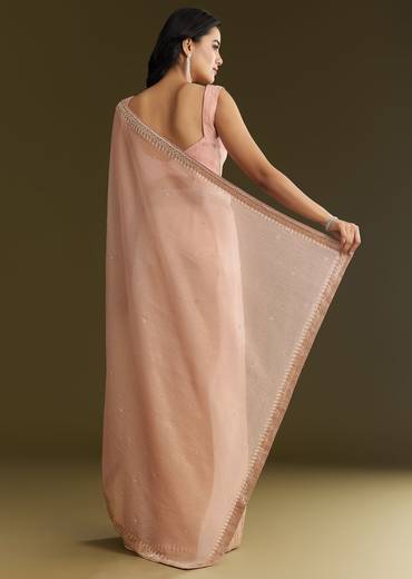 Beige Crushed Tissue Saree With Stone Embellishment And Glossy Finish