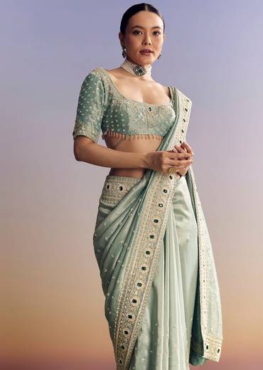 Blue Tissue Saree With Embroidered Border And Emerald Stone