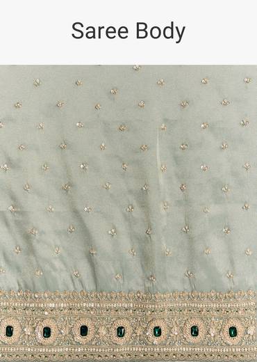 Blue Tissue Saree With Embroidered Border And Emerald Stone