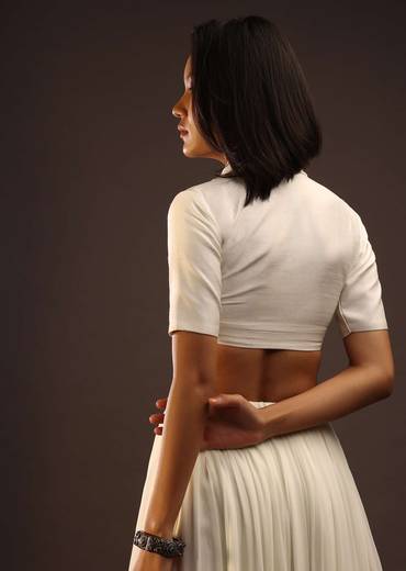 Egret White Half-Sleeved Blouse With Long Collar Neckline. Front Hook Closure With A Straight Hemline.