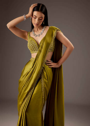 Green Silk Saree With Elegant Bead Work And Frills
