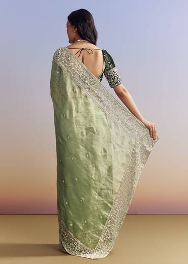 Green Tissue Saree With Velvet Blouse And Richly Embroidered Borders