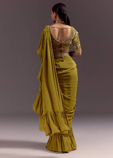 Olive Green Velvet Saree With Frilled Pallu And Heavy Embroidered Blouse