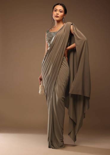 Taupe Grey Ready-Pleated Saree With A Crop Top In Foil Applique Embellishment Sleeveless With A Tie-Up Tassel Dori At The Back.