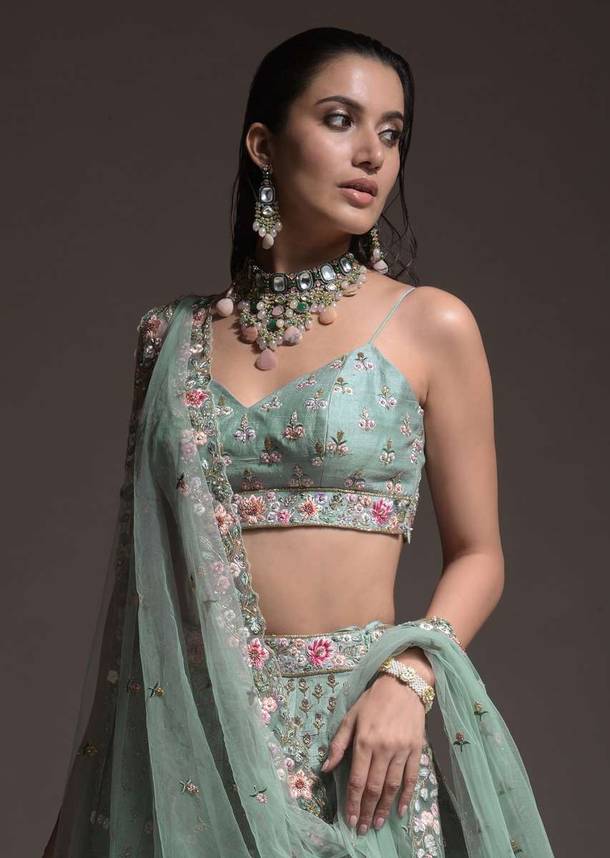 Sage Green Lehenga Choli In Raw Silk With Vibrant Resham Embroidered Cluster Of Summer Blooms And Buttis
