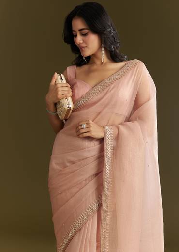 Beige Crushed Tissue Saree With Stone Embellishment And Glossy Finish