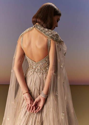 Beige Gown With Shoulder Cape And Rich Vertical Embroidery