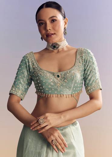 Blue Tissue Saree With Embroidered Border And Emerald Stone