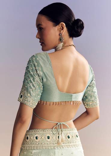 Blue Tissue Saree With Embroidered Border And Emerald Stone