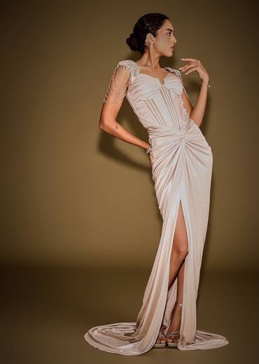 Champagne Drape Gown With Embroidered Shoulder Cape And Tassel Detailing