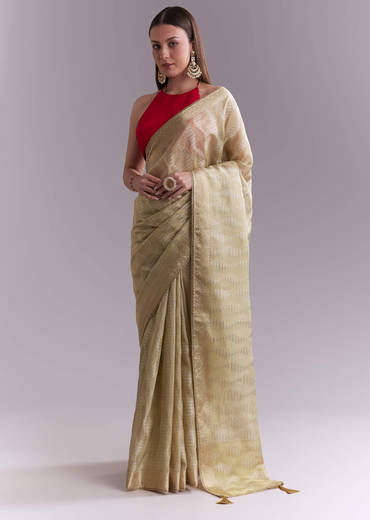 Cream Tissue Saree With Subtle Weave And Zari Border