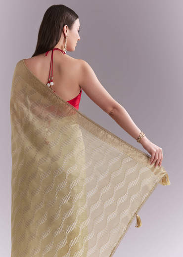 Cream Tissue Saree With Subtle Weave And Zari Border