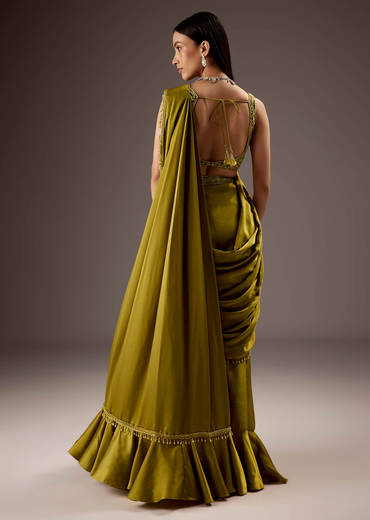 Green Silk Saree With Elegant Bead Work And Frills