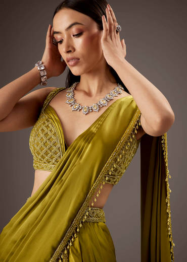 Green Silk Saree With Elegant Bead Work And Frills