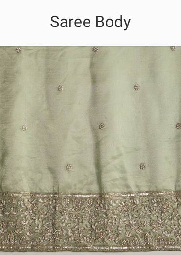 Green Tissue Saree With Velvet Blouse And Richly Embroidered Borders