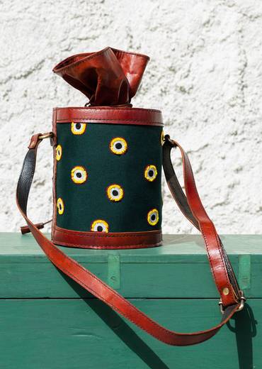 Handcrafted leather potli bag with bold colourful eye embroidery