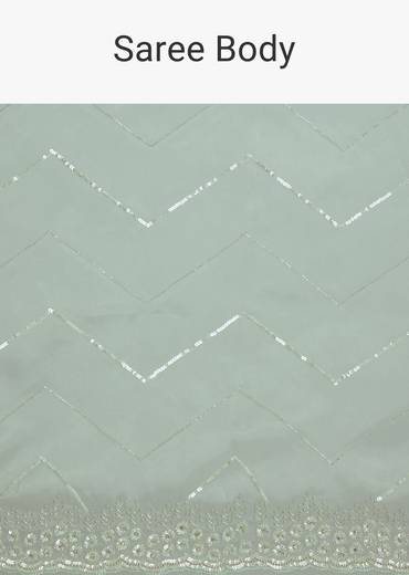Light Blue Glass Tissue Saree With Stone Embroidery And Scallop Border