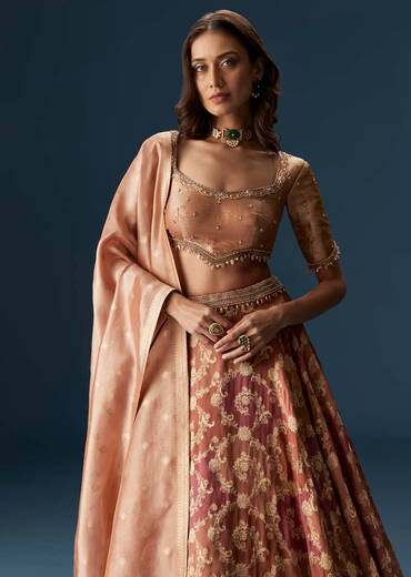 Orange Embroidered Blouse With Ruching Lehenga And Tassel Dupatta