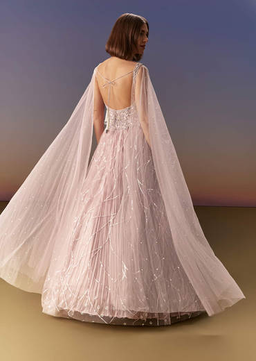 Pastel Pink Gown With Sheer Cape Drape And Heavy Embroidery