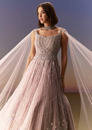 Pastel Pink Gown With Sheer Cape Drape And Heavy Embroidery