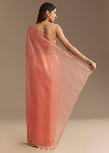 Peach Tissue Saree With Stones Cutdana Embellishments And Scallop Border