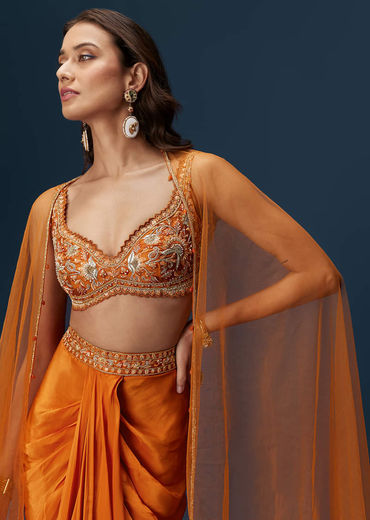 Rust Dhoti Skirt Set With Embellished Blouse And Tassel Net Dupatta