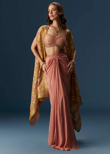 Rusty Pink Embroidered Blouse And Draped Skirt Set With Embellished Cape