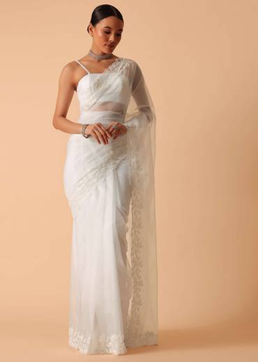 White Saree In Organza With Floral Motif Border And Unstitched Blouse Piece