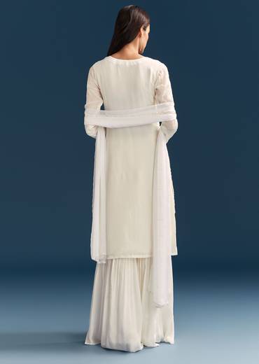 White Pakistani Sharara Suit With Sequin Details And Dupatta