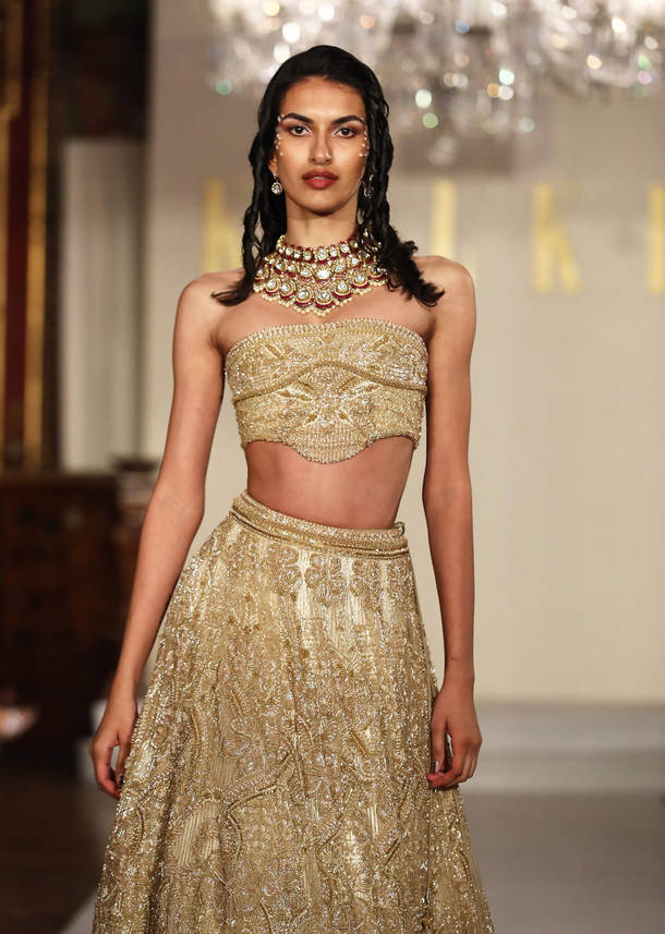 Gold Net Bridal Lehenga With Embroidered Corset Blouse