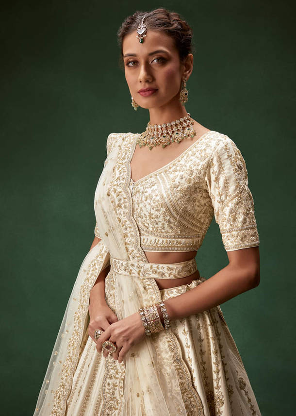 Off White Bridal Lehenga Set With Boat Neck Blouse And Regal Zari Work