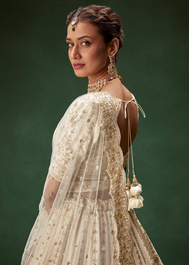Off White Bridal Lehenga Set With Boat Neck Blouse And Regal Zari Work