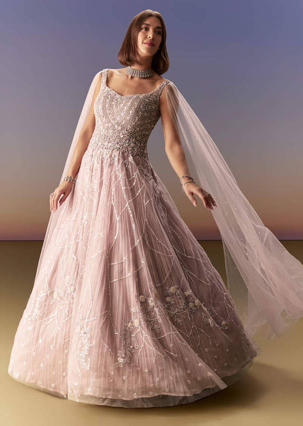 Pastel Pink Gown With Sheer Cape Drape And Heavy Embroidery