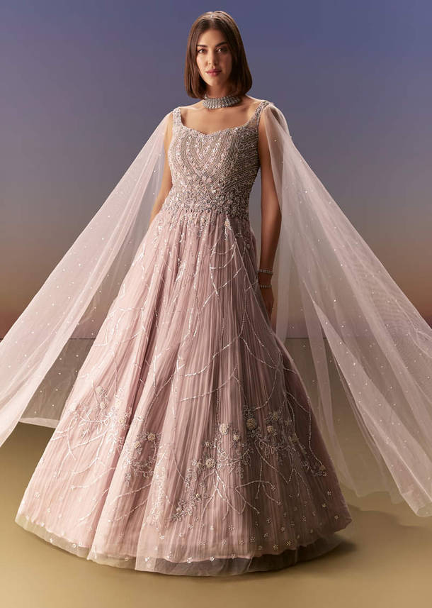 Pastel Pink Gown With Sheer Cape Drape And Heavy Embroidery