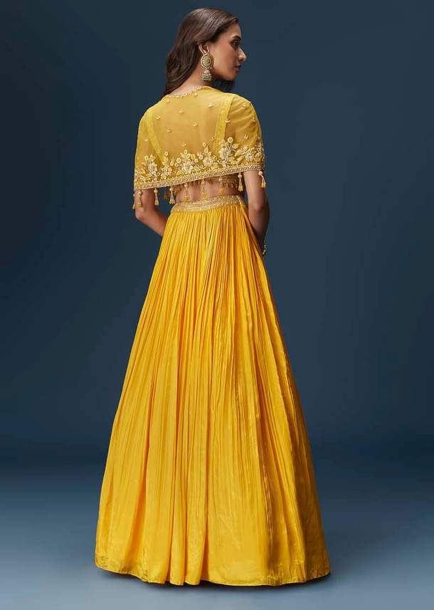 Yellow Bridesmaid Lehenga With Sleeveless Blouse And Draped Cape