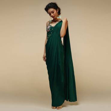 Bottle Green Saree Gown With A Crepe Cowl Drape And Sheer Embroidered Net Bodice With Colorful Resham Flowers