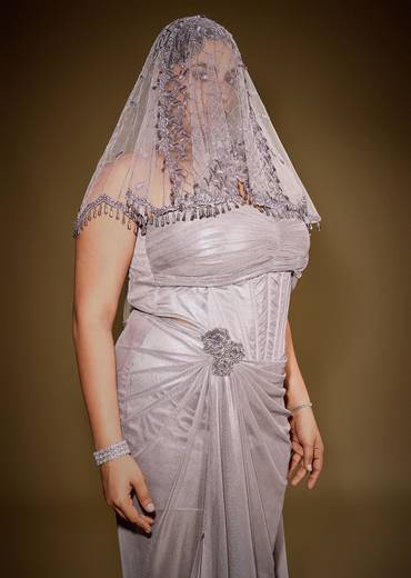 Gold One Shoulder Drape Gown With Embroidered Floral Brooch And Trail