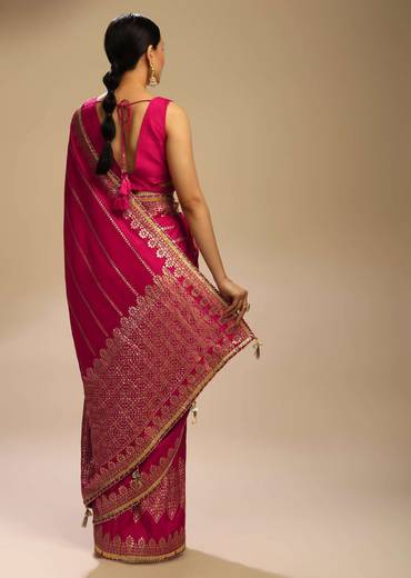 Rani Pink Saree In Silk With Woven Stripes Floral Motifs On The Border