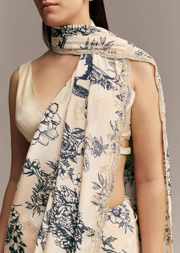 Off White Crepe Saree With Black Floral Print And Embroidered Border