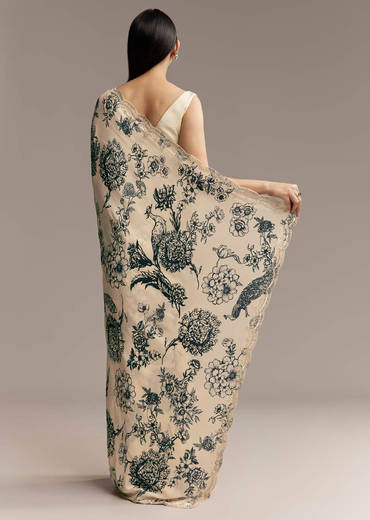 Off White Crepe Saree With Black Floral Print And Embroidered Border
