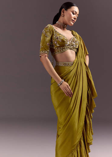 Olive Green Velvet Saree With Frilled Pallu And Heavy Embroidered Blouse