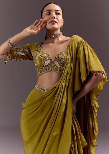 Olive Green Velvet Saree With Frilled Pallu And Heavy Embroidered Blouse