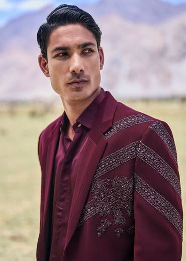 Deep Wine Self Embroidered Tuxedo With Geometric Motifs
