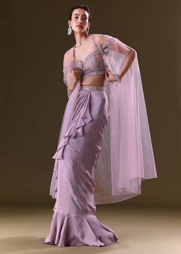 Mauve Ruffled Drape Skirt With Embroidered Blouse And Net Cape